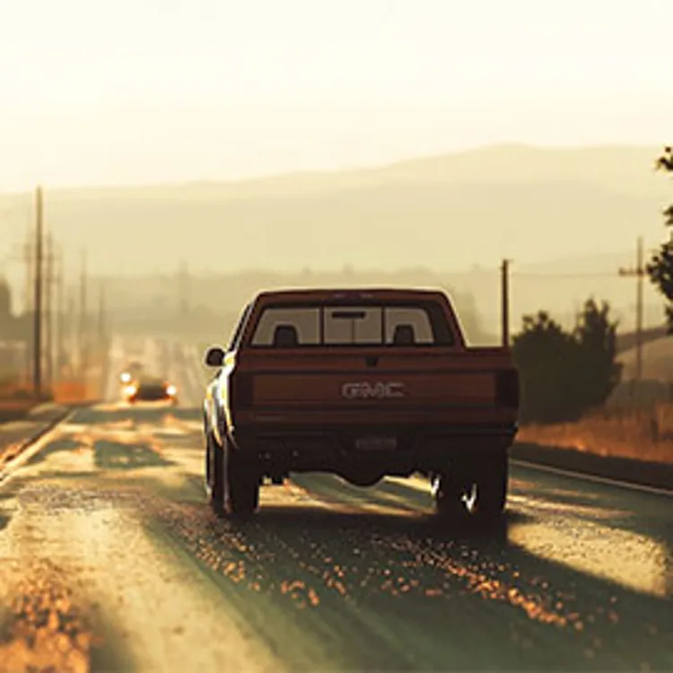 back view of a gmc sierra on a highway