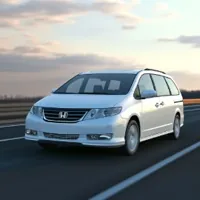 a silver Honda Odyssey on a highway
