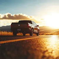 back view of a honda ridgeline on a highway