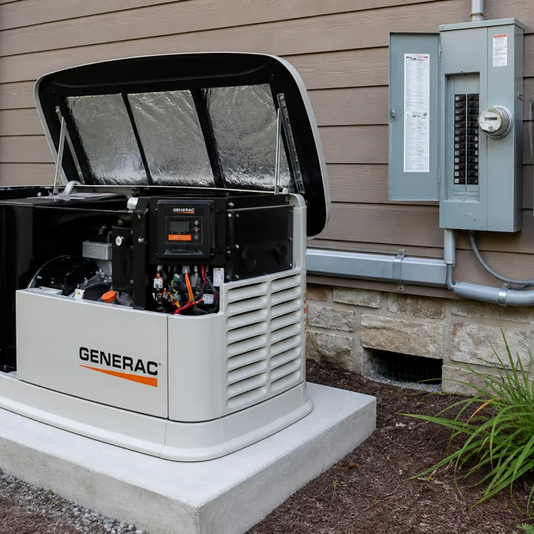 Standby generator with open lid next to electrical panels mounted on the exterior wall of a house