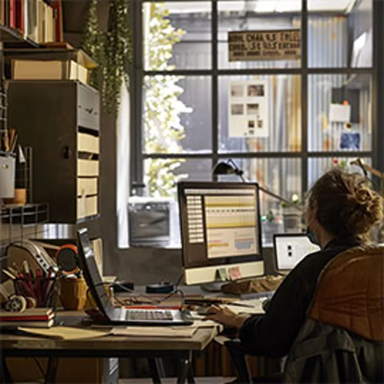 man working on computer doing taxes