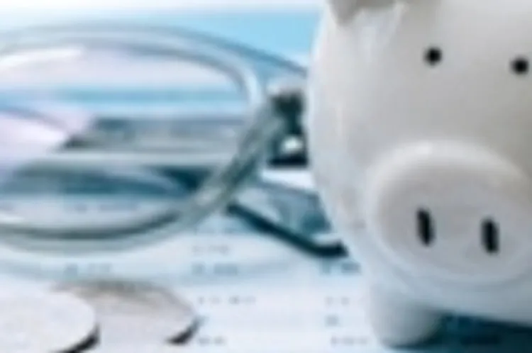 calculator with piggy bank, coins, and paperwork