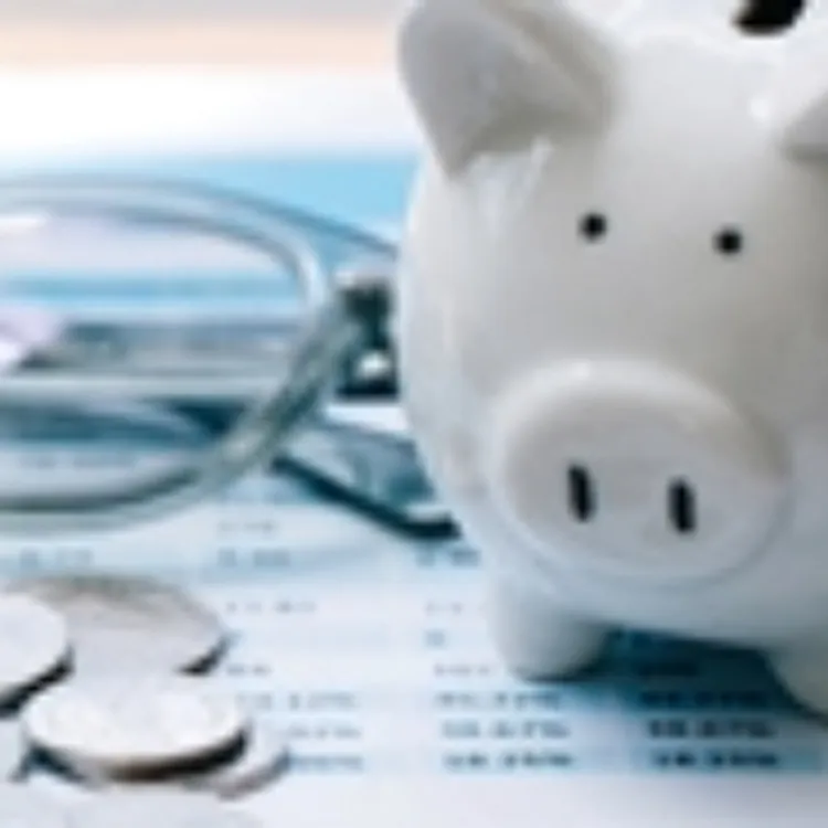 calculator with piggy bank, coins, and paperwork