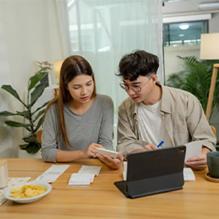young couple discussing finances at home