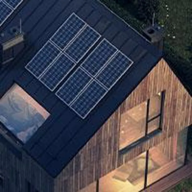 house with solar panels at night