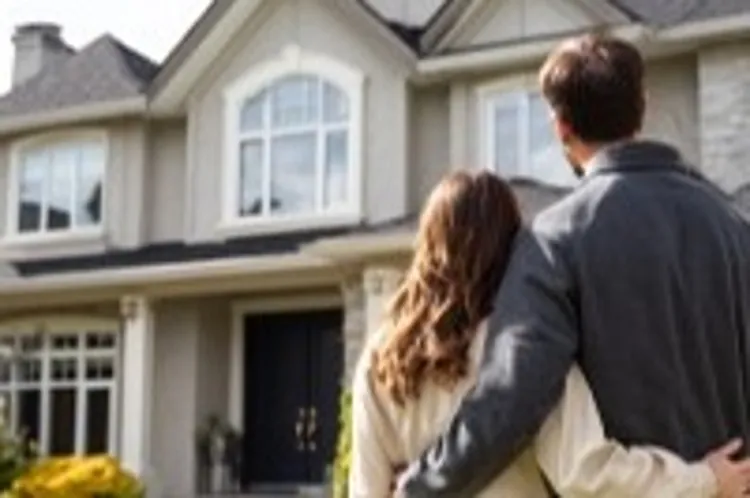 a couple standing in front of a house with a big lawn