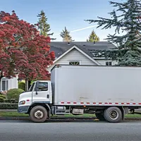 moving truck parked outside of a home