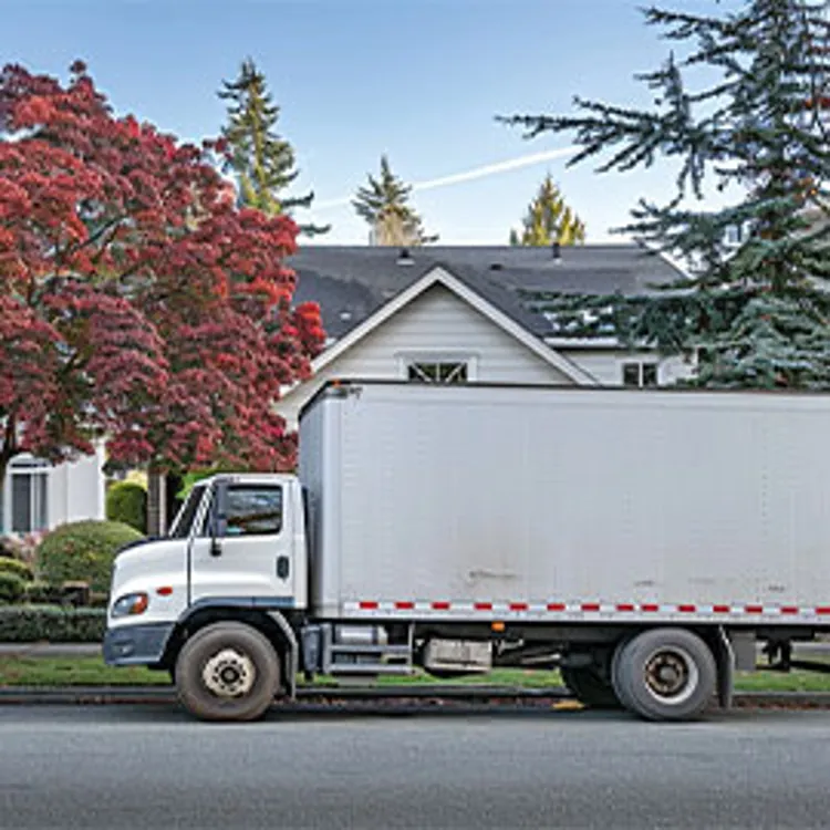 moving truck parked outside of a home