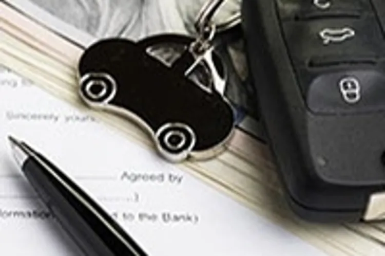 car key remote on top of money and documents