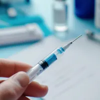 a syringe filled with blue liquid