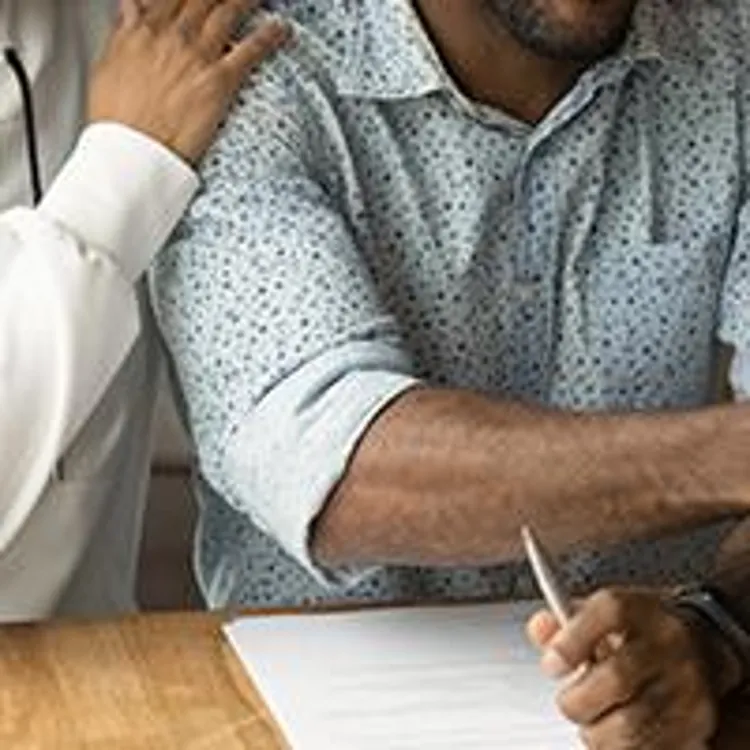 couple shaking hands with mortgage lender
