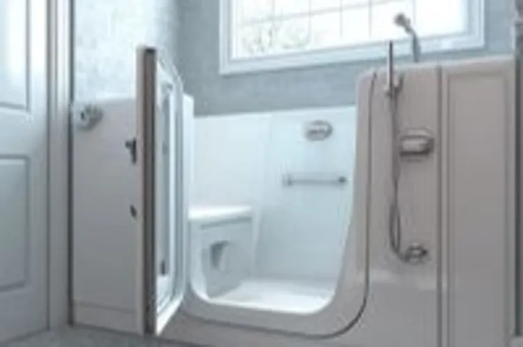 a walk-in tub inside a gray tiled bathroom with a rectangular window