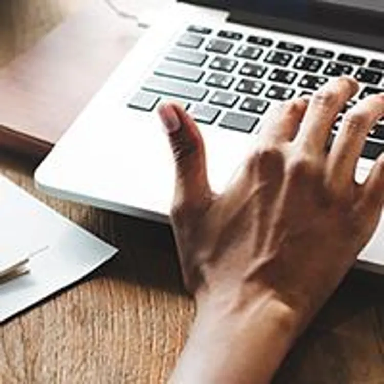 woman writing and typing