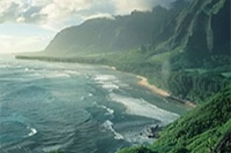 coastline with green mountains in the background
