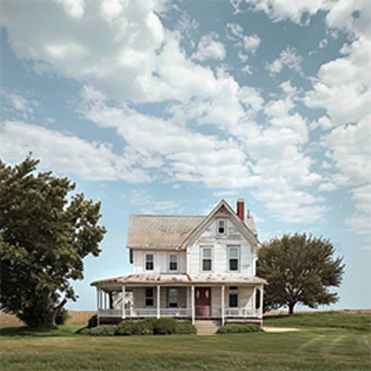 typical kansas home under a cloudy blue sky