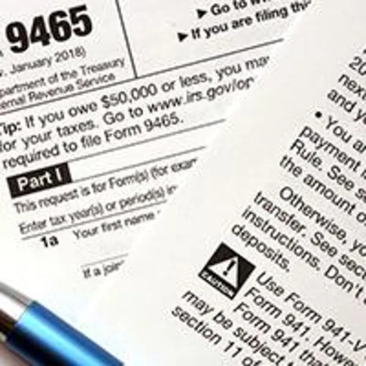 tax forms and pen