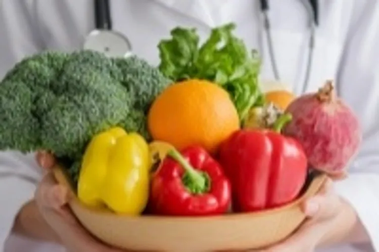 a dietitian holding a bowl of vegetables