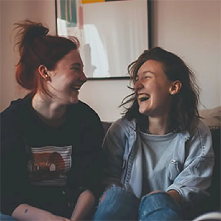 two women chatting happily