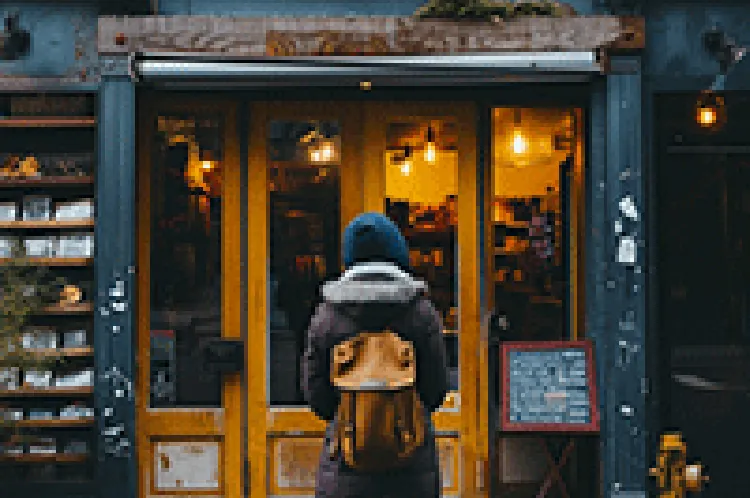 woman looking at store facade