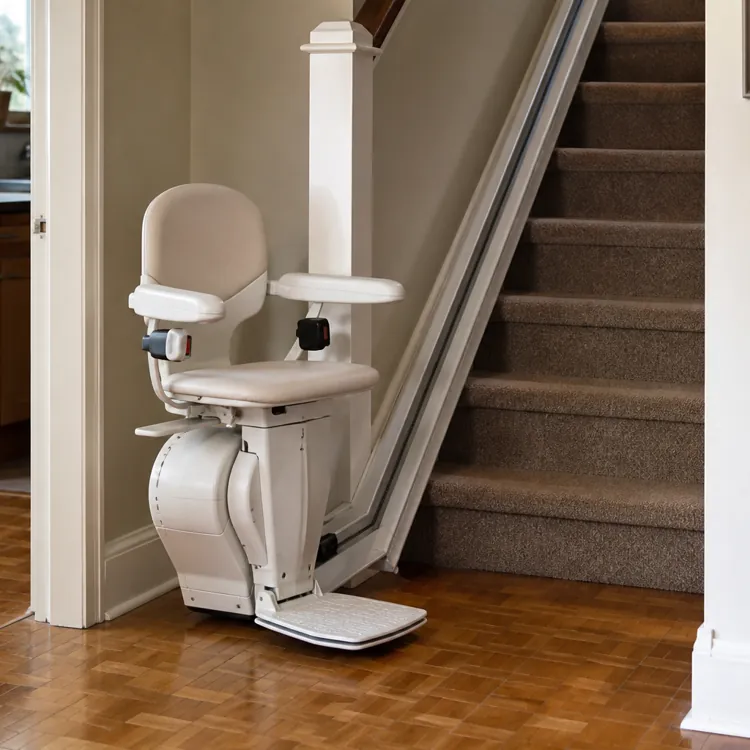 Motorized stair lift chair installed at the base of a carpeted staircase in a home interior