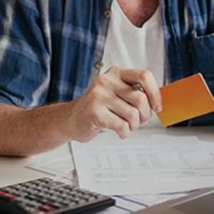 man working on finances