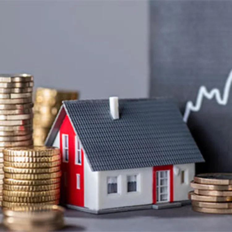 stacks of coins beside model house and upward graph