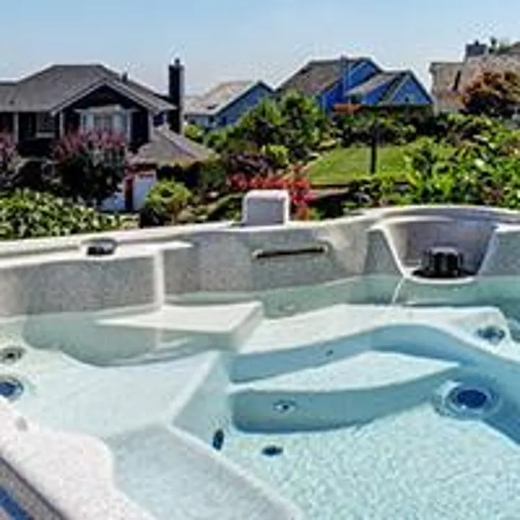 hot tub on a porch overlooking a neighborhood