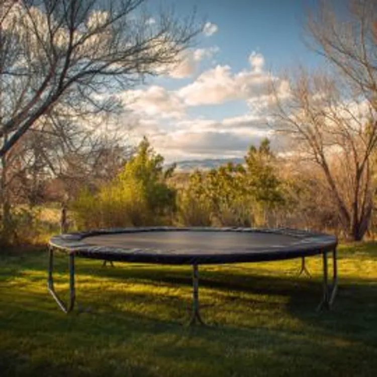 a trampoline in a yard