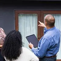 agent showing a home to two women