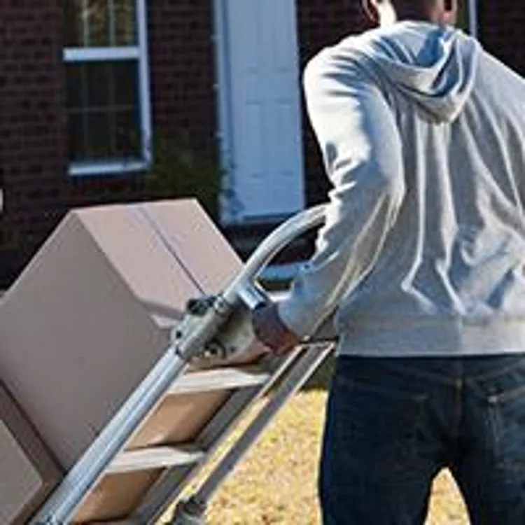 family loading a moving truck