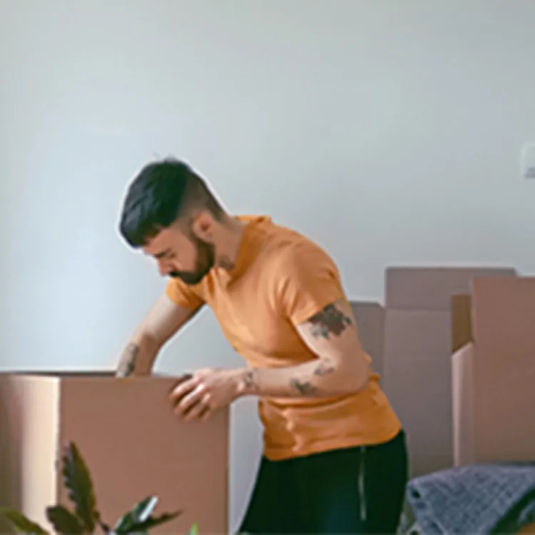 man packing in boxes