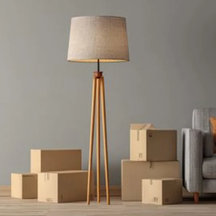 a lamp and a bunch of boxes for moving