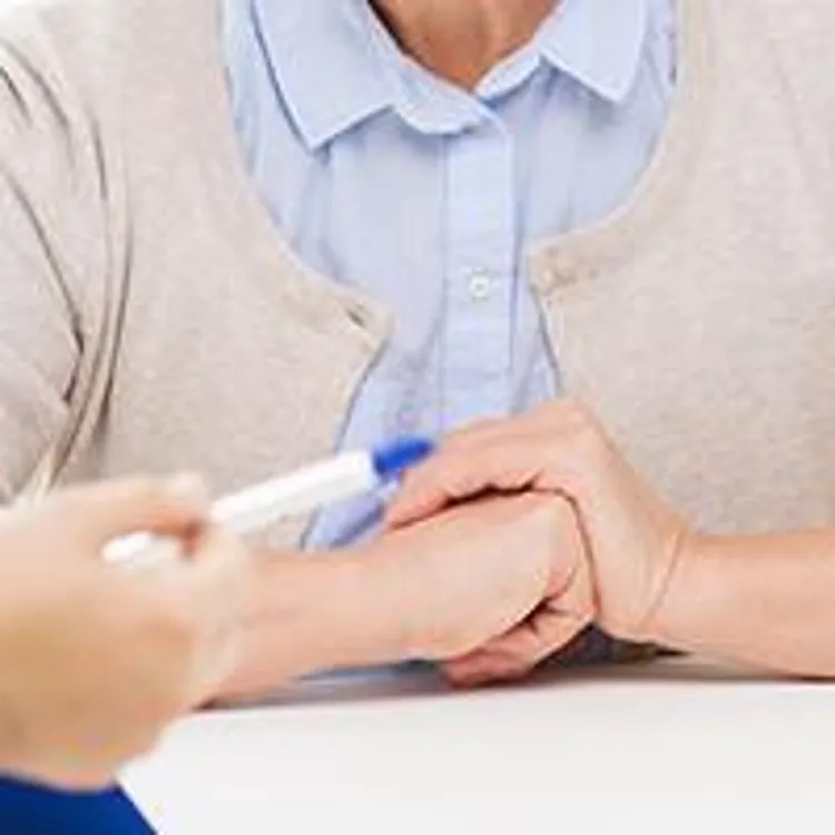 senior woman sitting in a doctors office