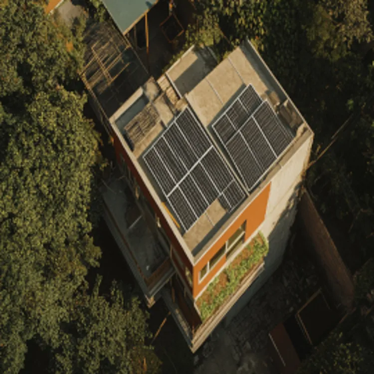 aerial view of a building with solar panels on the roof