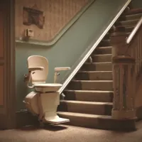 a stair lift sitting at the bottom of a staircase