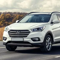 white hyundai sta fe on the road