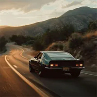 black car driving on road