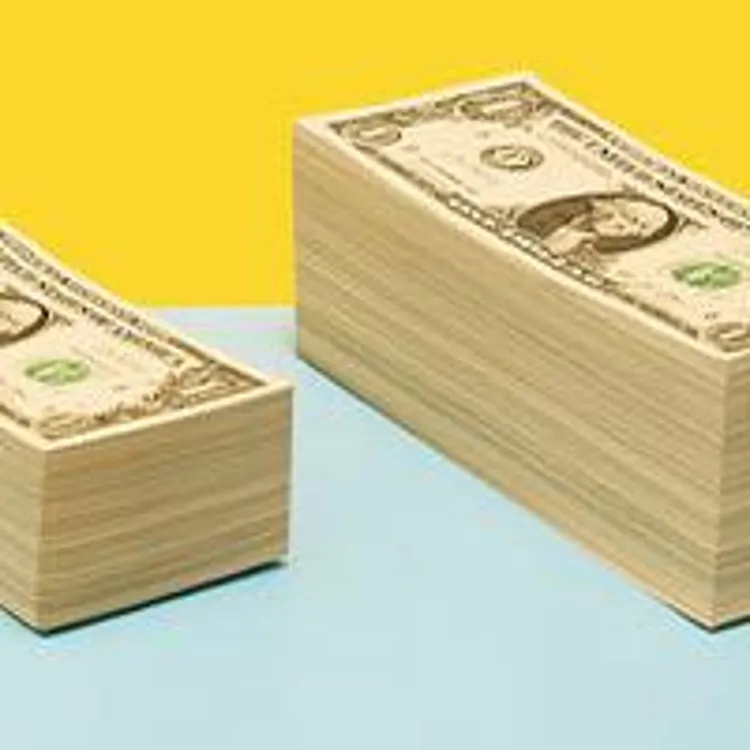stacks of dollar bills arranged in increasing heights