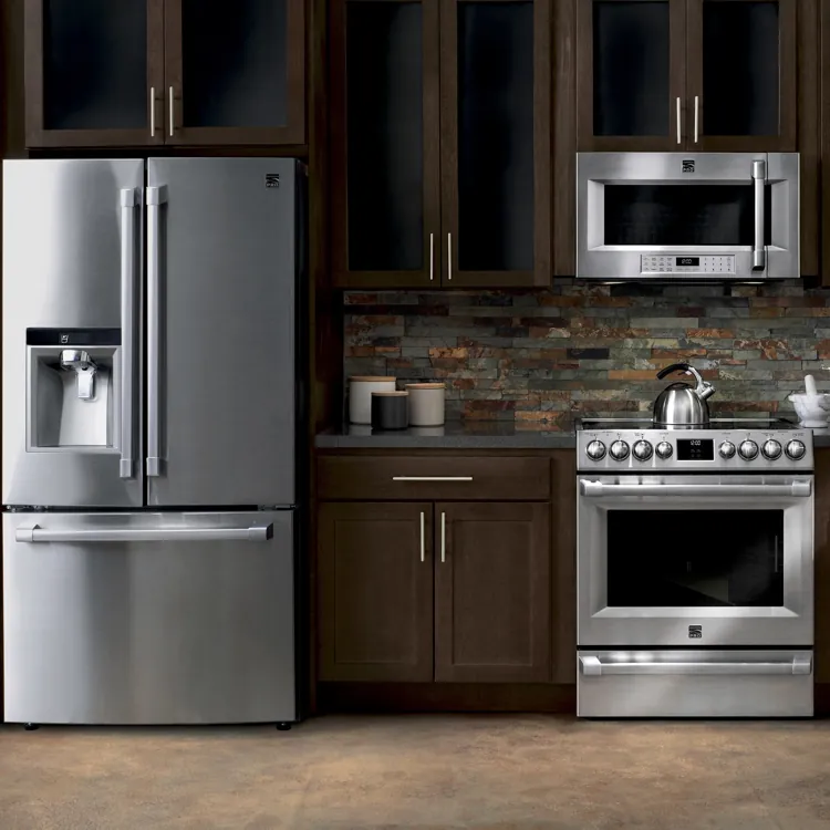 Modern kitchen with stainless steel refrigerator, oven, microwave, and dark wood cabinets