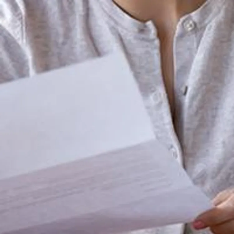woman holding letter from irs