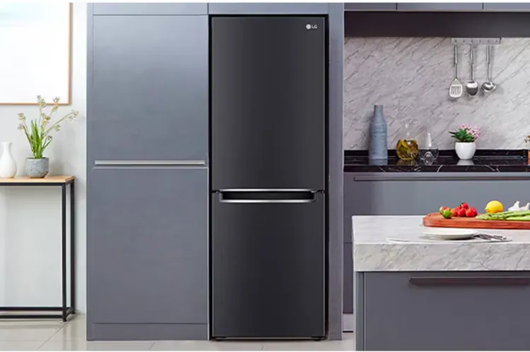 sleek black lg refrigerator in a modern gray kitchen with marble countertops and fresh produce on island