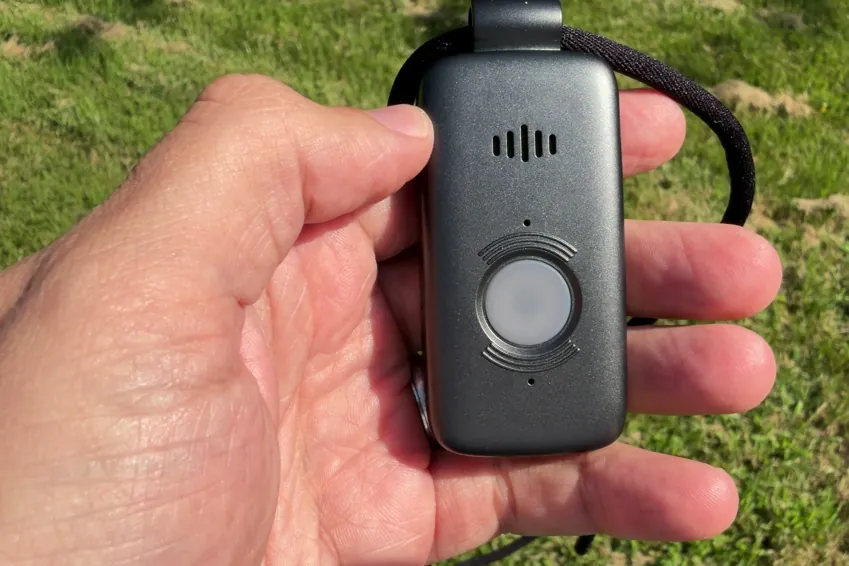 Belle X2 pendant held in an open palm outdoors