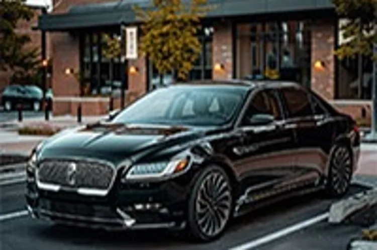 a lincoln parked in a lot outside a commercial building
