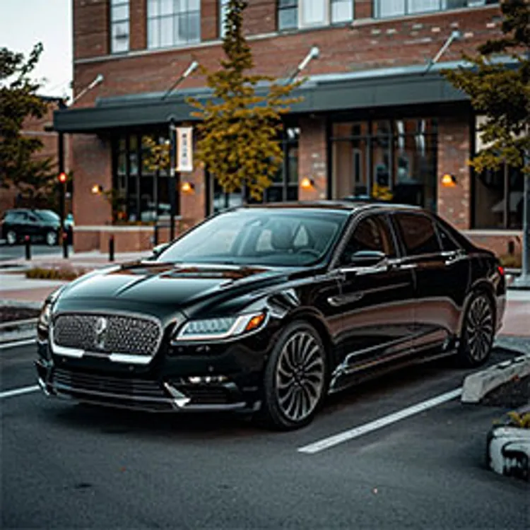 a lincoln parked in a lot outside a commercial building