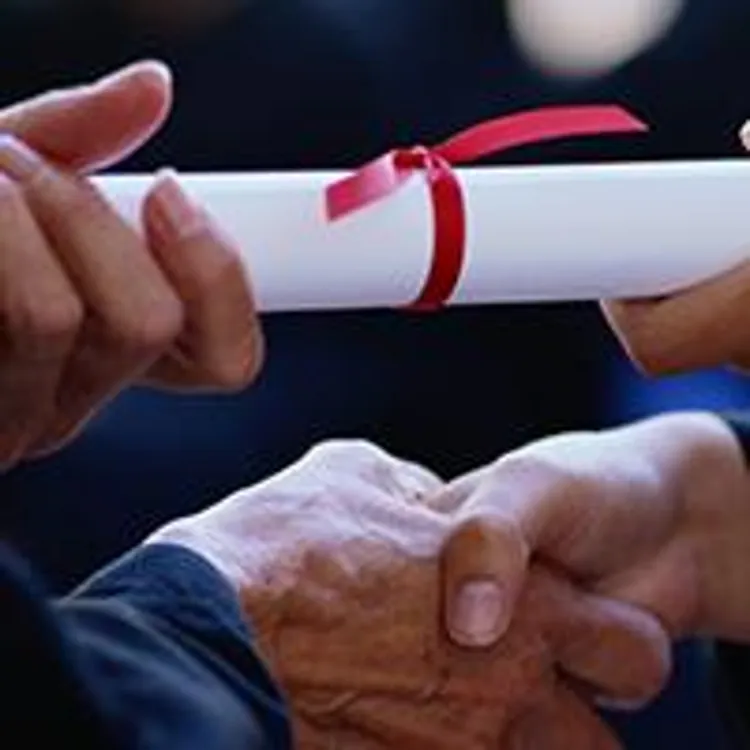 diploma passing between hands