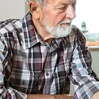 male nurse taking mans blood pressure