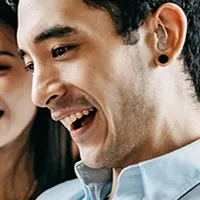 man wearing invisible hearing aid