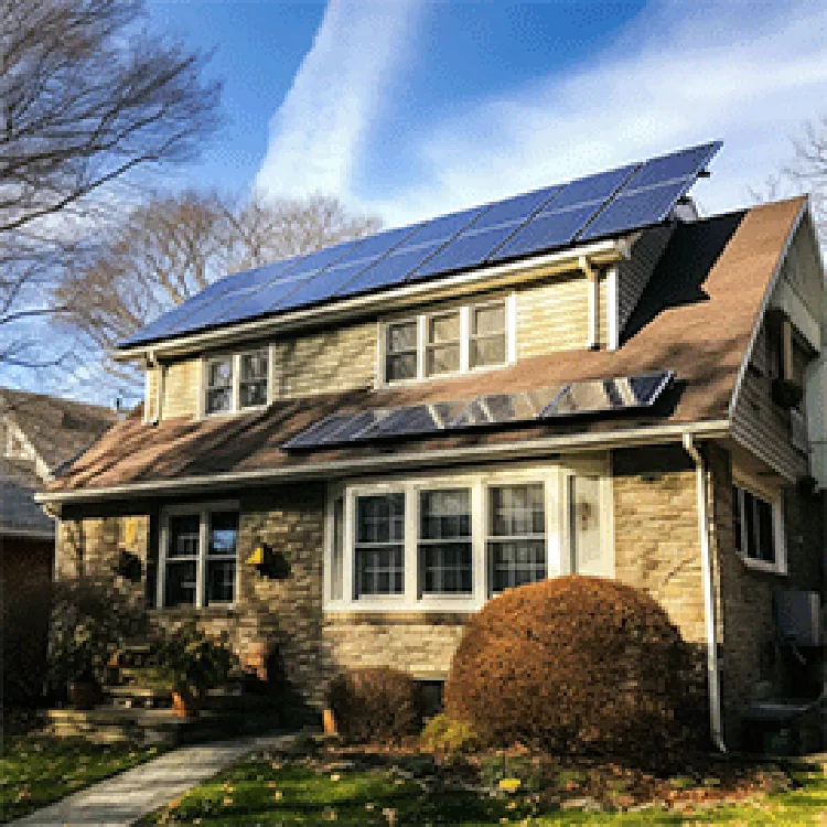 two-story house with solar panels on roof