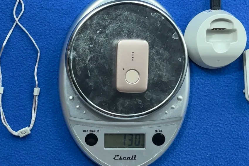 MGMini pendant on a kitchen scale reading 1.30 ounces