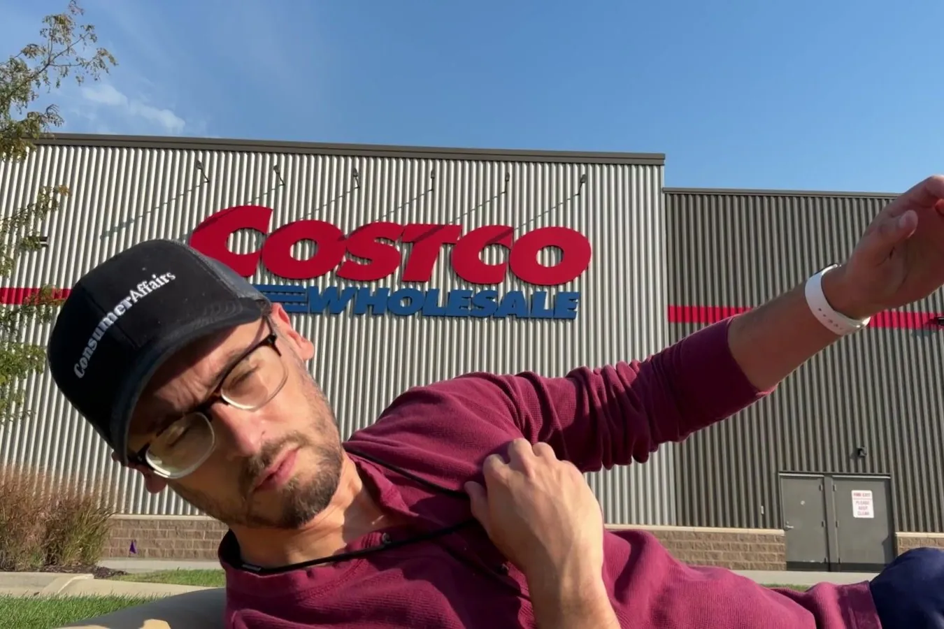 Video: I Fell 104 Times To Show You How Fall Detection Works. Chris, wearing a ConsumerAffairs cap and a medical alert pendant, mid-fall in front of a Costco